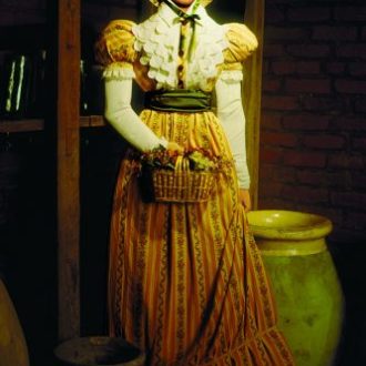 A painting of a woman in the Laura Creole PLantation