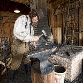 A blacksmith working on an anvil