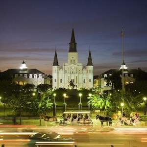 a large clock tower towering over a city at night