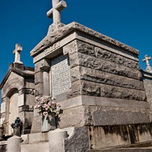a large stone statue in front of a building