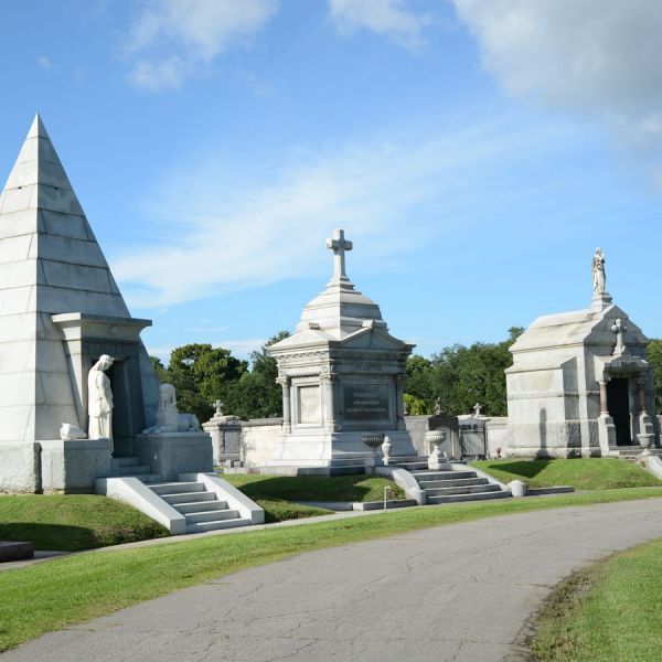 a large stone statue in front of a building