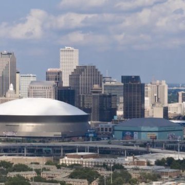 a large passenger jet flying over a city