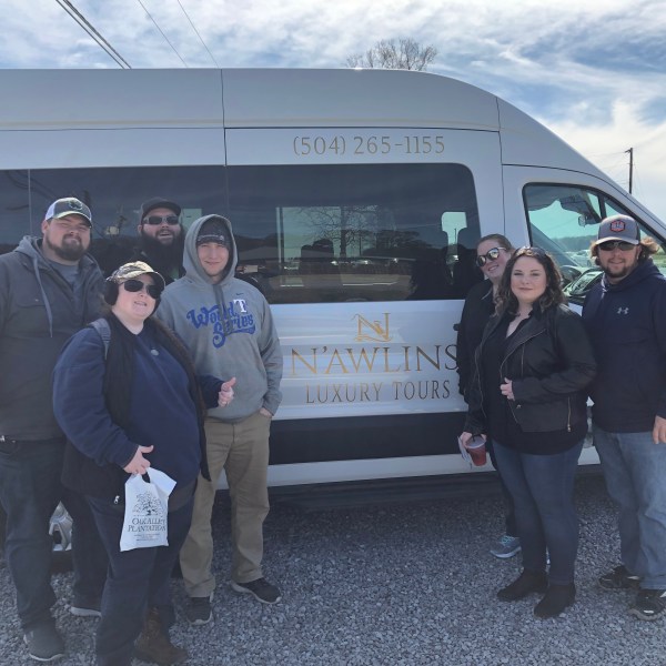 a group of people standing in front of a truck