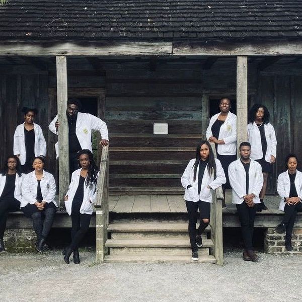 a group of people standing in front of a building