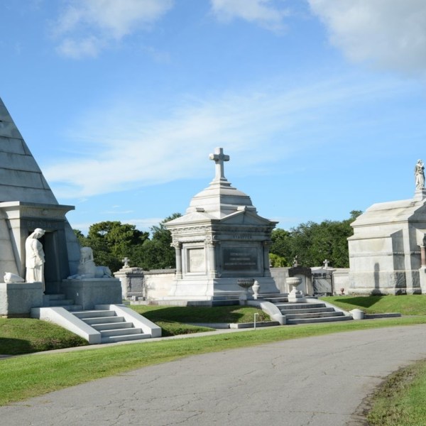 a large stone statue in front of a building