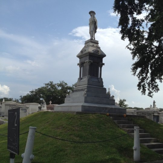a clock tower in the middle of a park